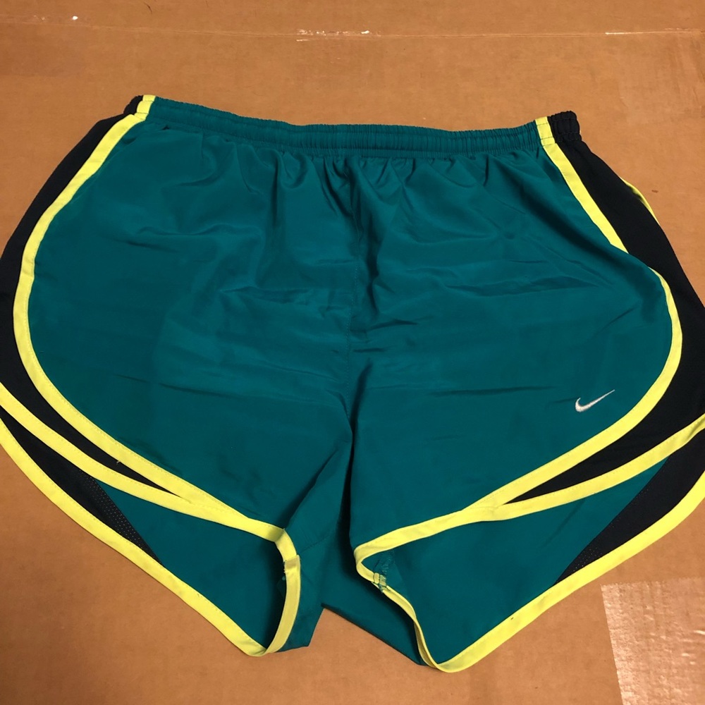 Teal Dri-Fit Nike shorts with neon yellow seams